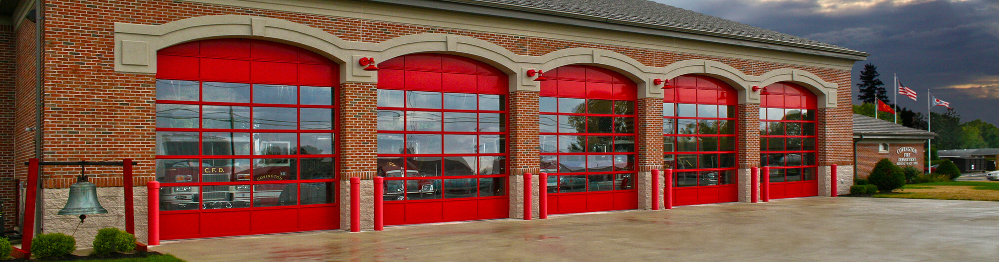 Red architectural series commercial doors on fire station