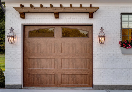 Clopay Bridgeport door on white home with pergula