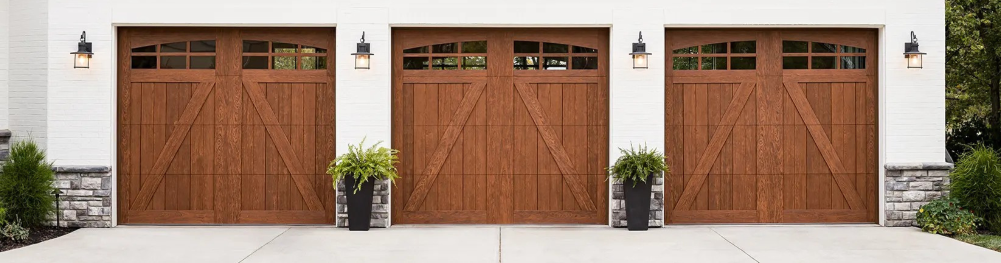 three carriage house wood look garage doors with windows